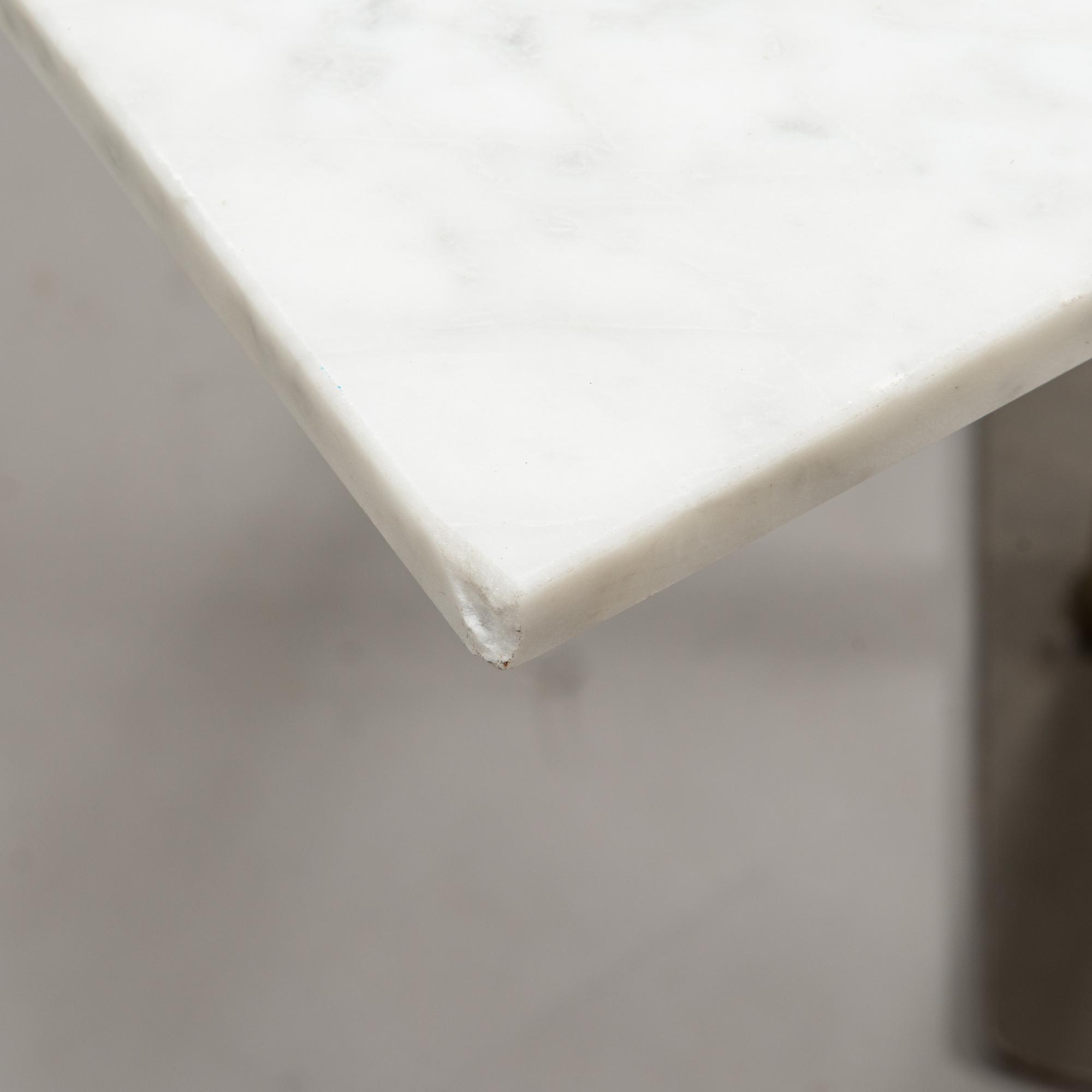 A marble top table, 21th century.