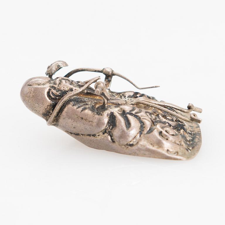 A silver figurine. China early 20th century.