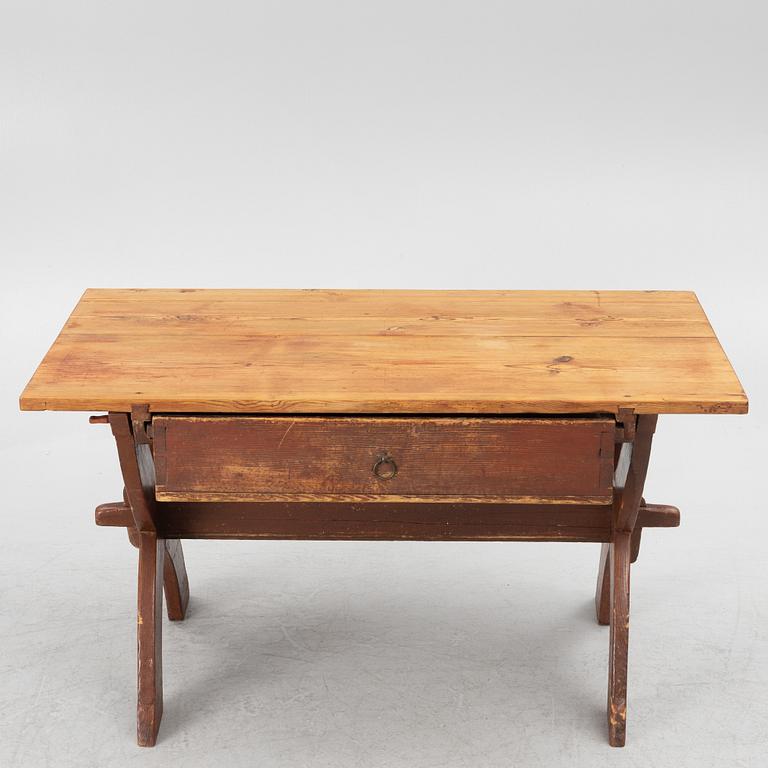A Swedish folk-art trestle table from Dalarna, dated 1854.