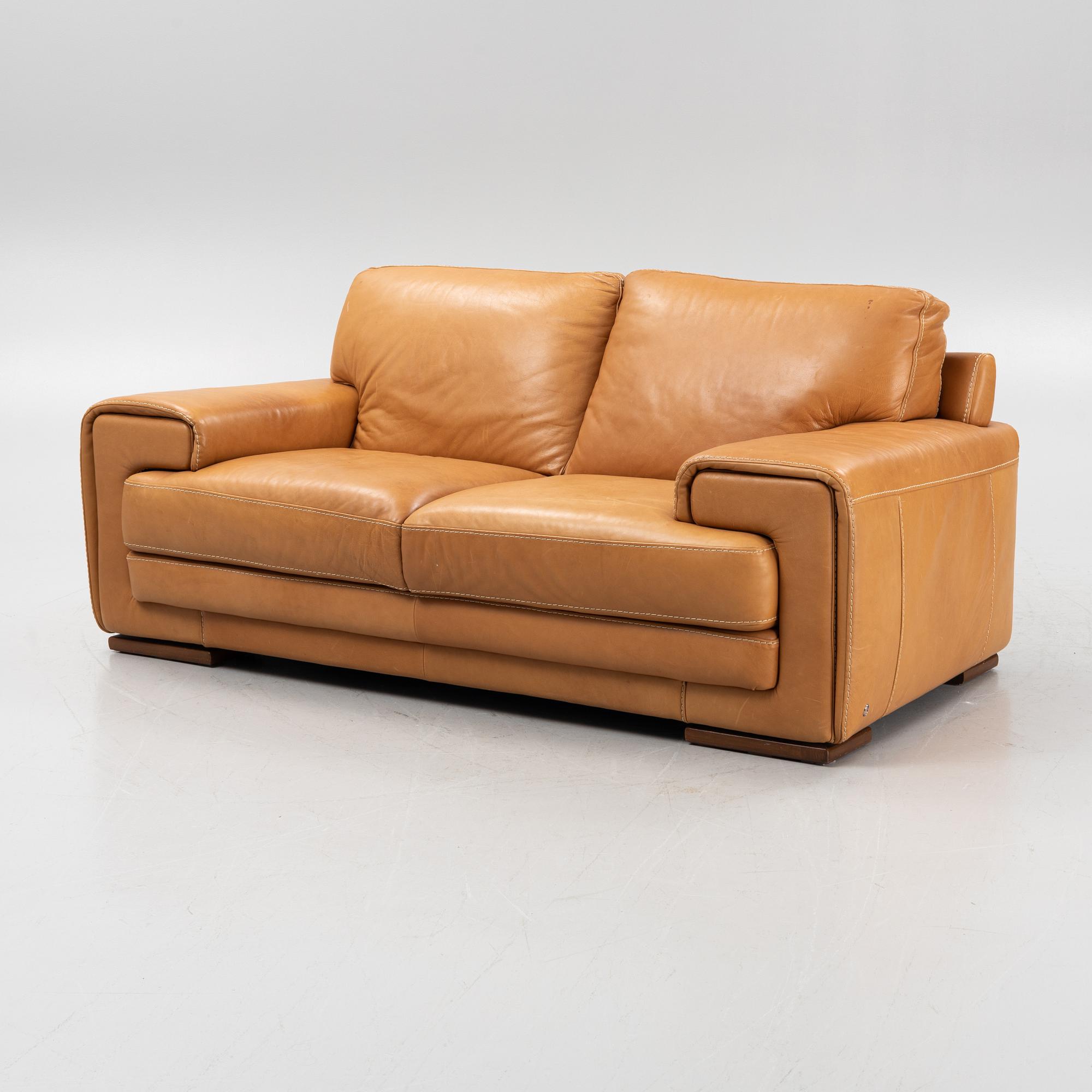 A leather upholstered sofa from Natuzzi.