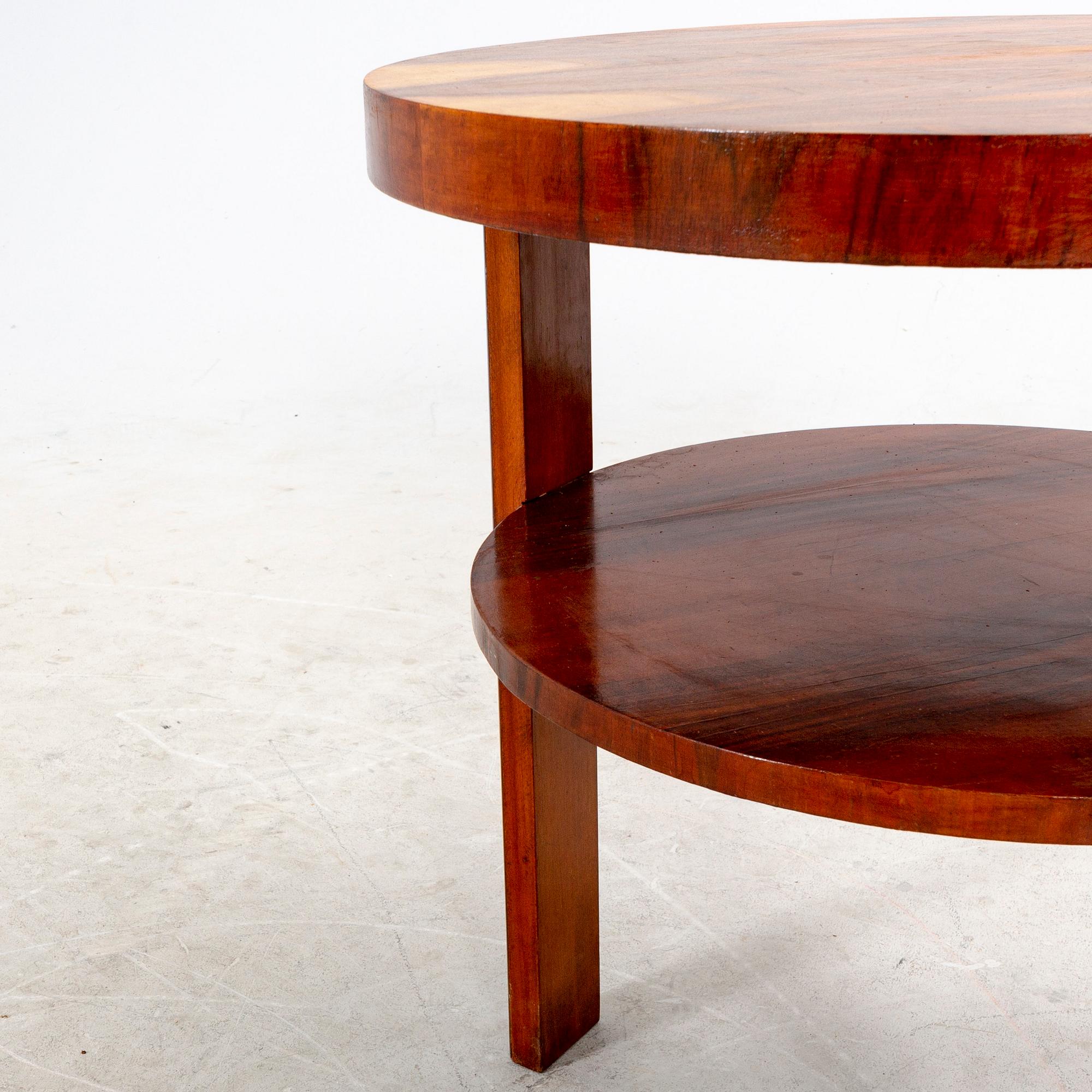 A veneered table from the first half of the 20th century.