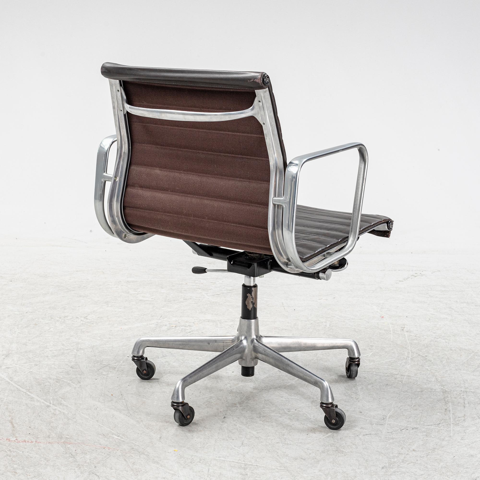 An EA 118 swivel office chair by Charles and Ray Eames for Herman Miller.