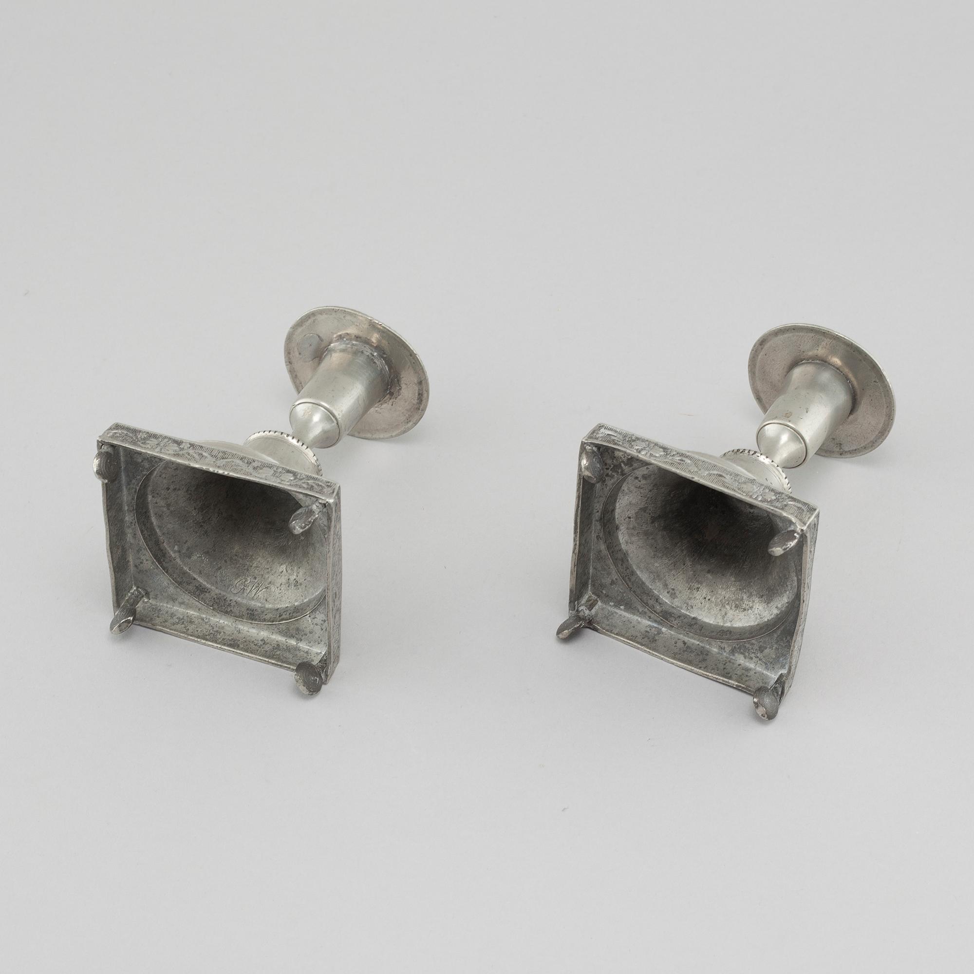A pair of pewter candlesticks, probably by Gustaf Frederic Wigholm in Eskilstuna, first half of the 19th century.