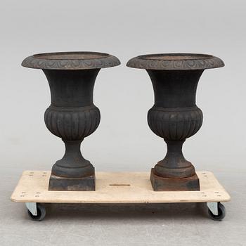 A pair of cast iron plant pots, late 20th century.