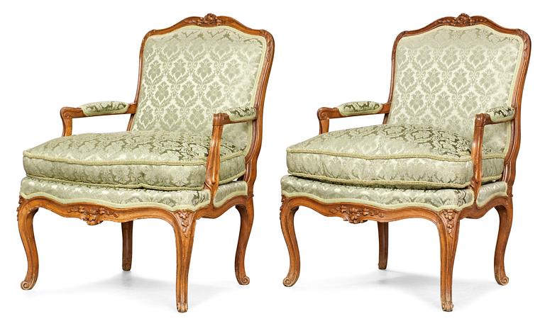 A pair of Louis XV armchairs.