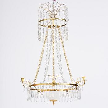 A late Gustavian gilt brass and cut glass four-light chandelier, Stockholm, late 18th century.