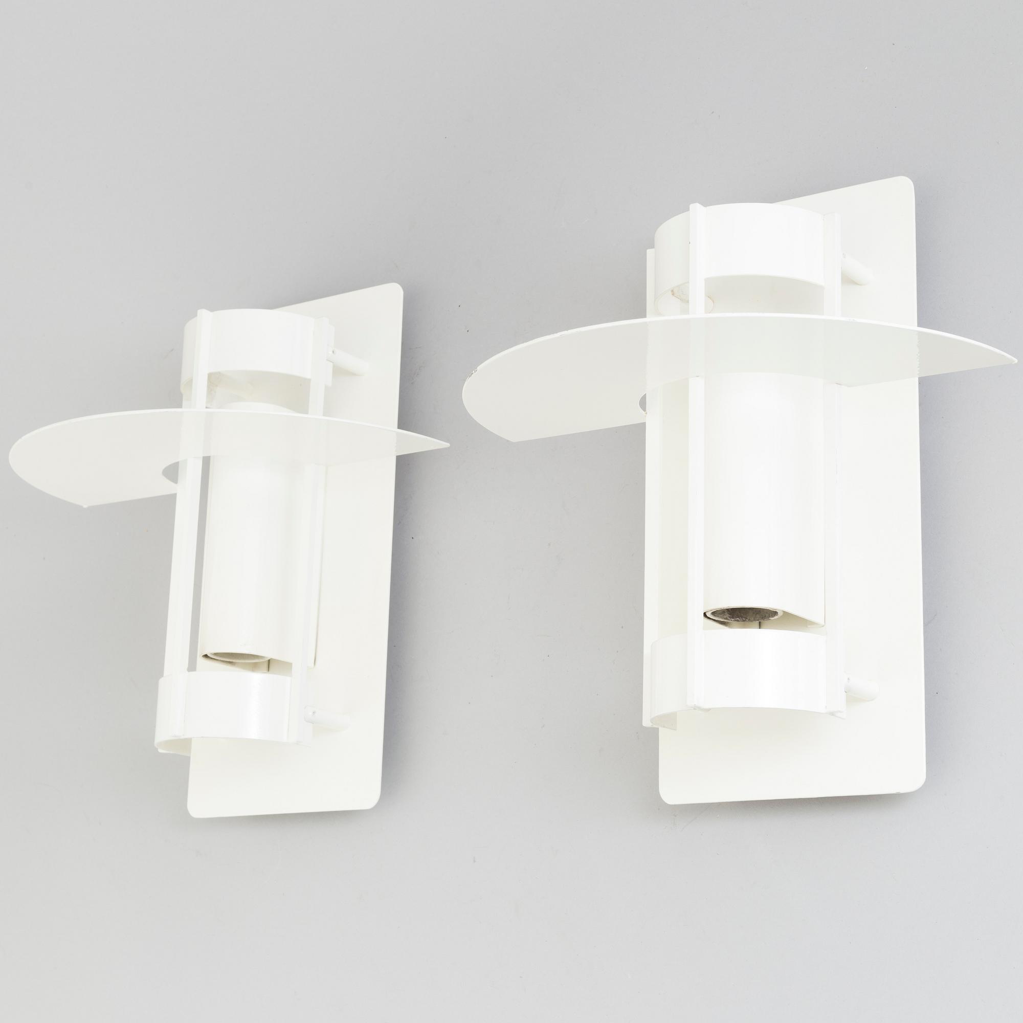 A set of two wall lamps by Joachim Lepper for Louis Poulsen, Danmark.