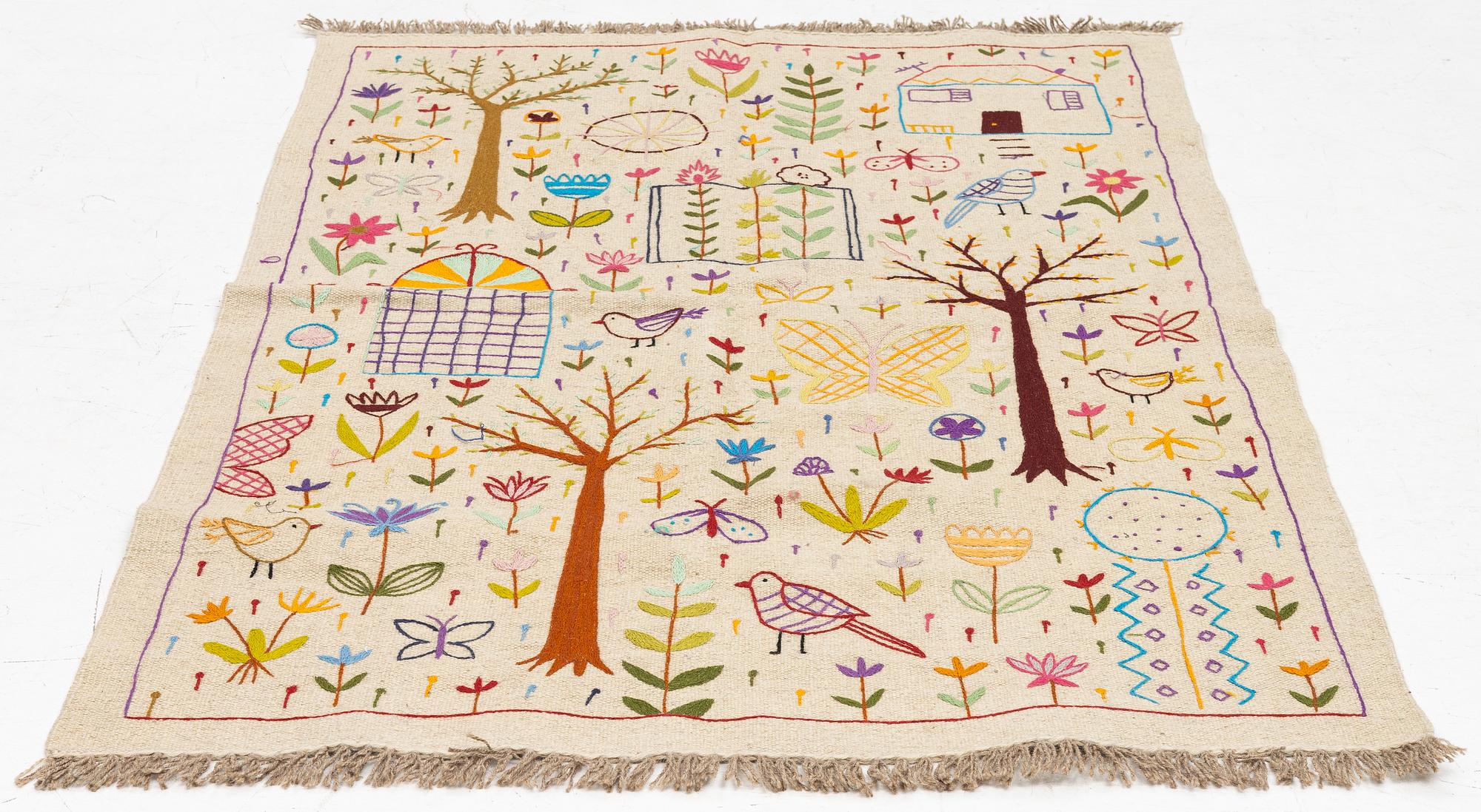 A hand-embroidered Kelim rug, c. 177 x 122 cm.