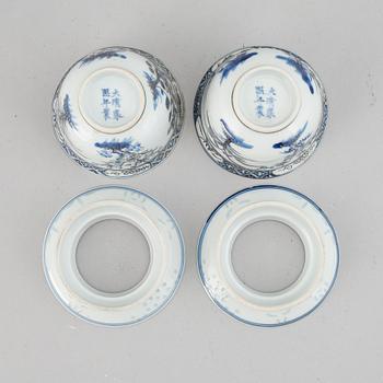 A pair of blue and white cups with stands, late Qing dynasty.