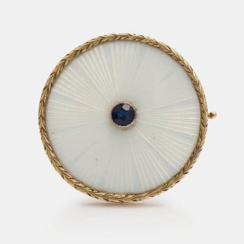 An 14K gold brooch with a synthetic sapphire and  enamel. St. Petersburg, early 20th century.