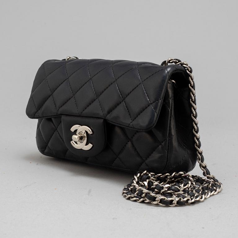 CHANEL, a black leather 'Extra mini flap bag' 2012-13.