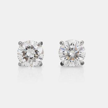 A pair of brillian-cut diamond earrings. Total carat weight of diamonds 2.01ct.