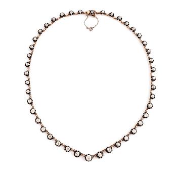 A gold and silver necklace set with old- and rose-cut diamonds.