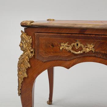 A French Louis XV-style rosewood marquetry 'Bureau plat aux bustes de femmes", late 19th century.