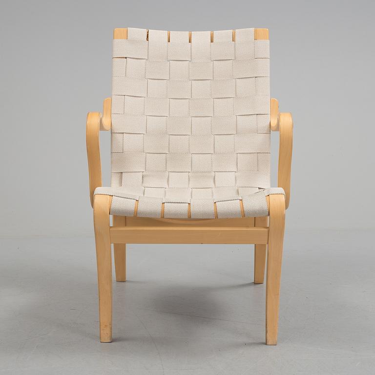 An "Mina" armchair by Bruno Matsson.