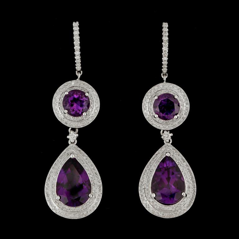 A pair of amethyst and brilliant-cut diamond earrings.