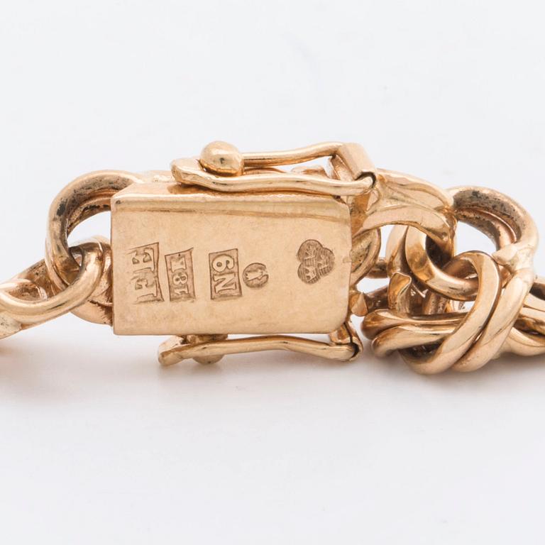 ARMBAND, 18K guld bismarcklänk med 5  berlocker, 21,7 g, Esto AB Guldvarufirman Stockholm 1963.