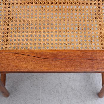 A Chinese hardwood dinner table and ten chairs with rattan seats, 20th century.