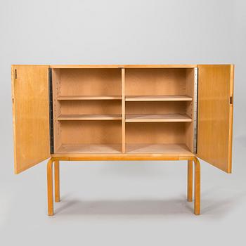 Alvar Aalto, mid-20th century '810' cabinet and a 
'69'chair Oy Huonekalu- ja Rakennustyötehdas Ab.