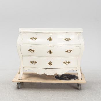 A painted rococo chest of drawers, mid 18th Century.