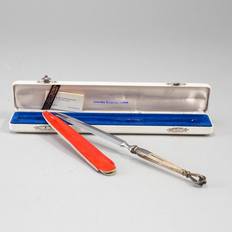 Swedish America Line, six pieces om memorabilia, including W&S Sörensen sterling silver letter opener in original bow.