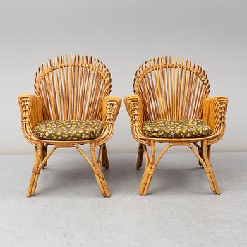 A pair of rattan armchairs, Emilio Paoli, via Vigna Nuova, 8, Firenze, Italy, second half of the 20th century. Signed.