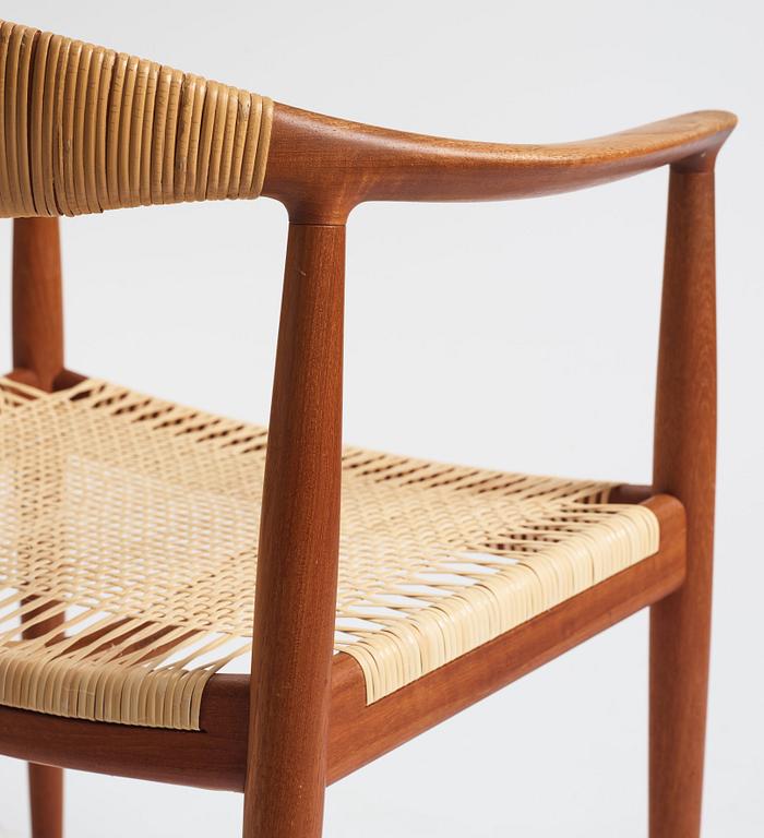 Hans J. Wegner, a pair of teak and rattan 'The Chair', JH-503, Johannes Hansen, Denmark 1950s.