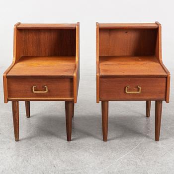 A pair of teak veneered bedside tables.