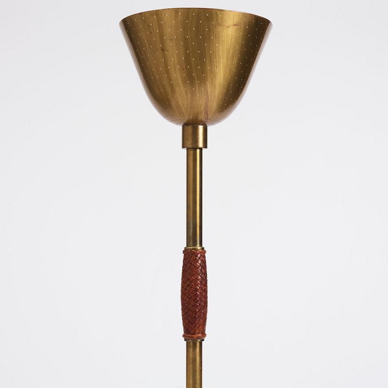 Carl-Axel Acking, a brass and leather floor lamp, designed for the Stockholm Association of Crafts in 1939.