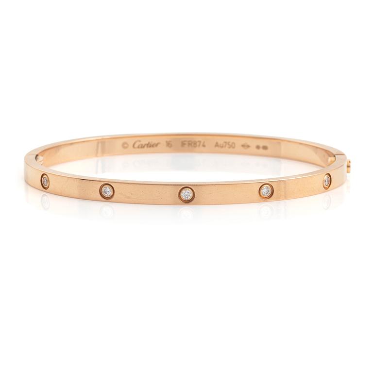 A Cartier "Love" bracelet small model in 18K rose gold with ten round brilliant-cut diamonds.