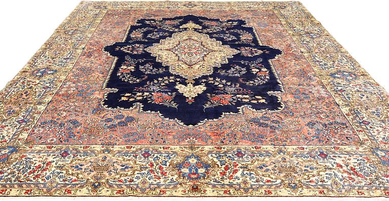 A semi-antique Kerman carpet, approximately 358 x 268 cm.