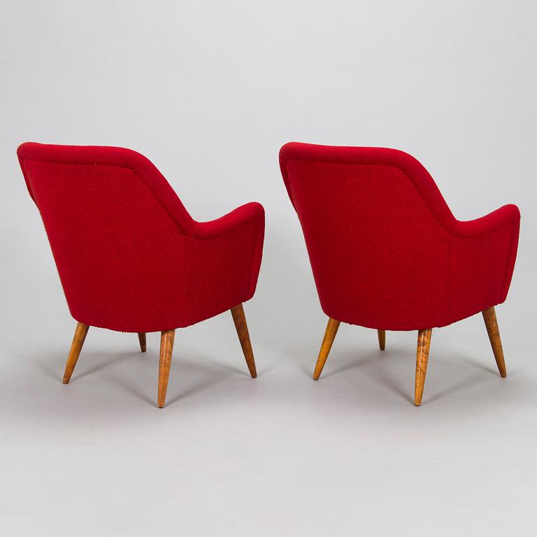 A pair of mid-20th century armchairs.