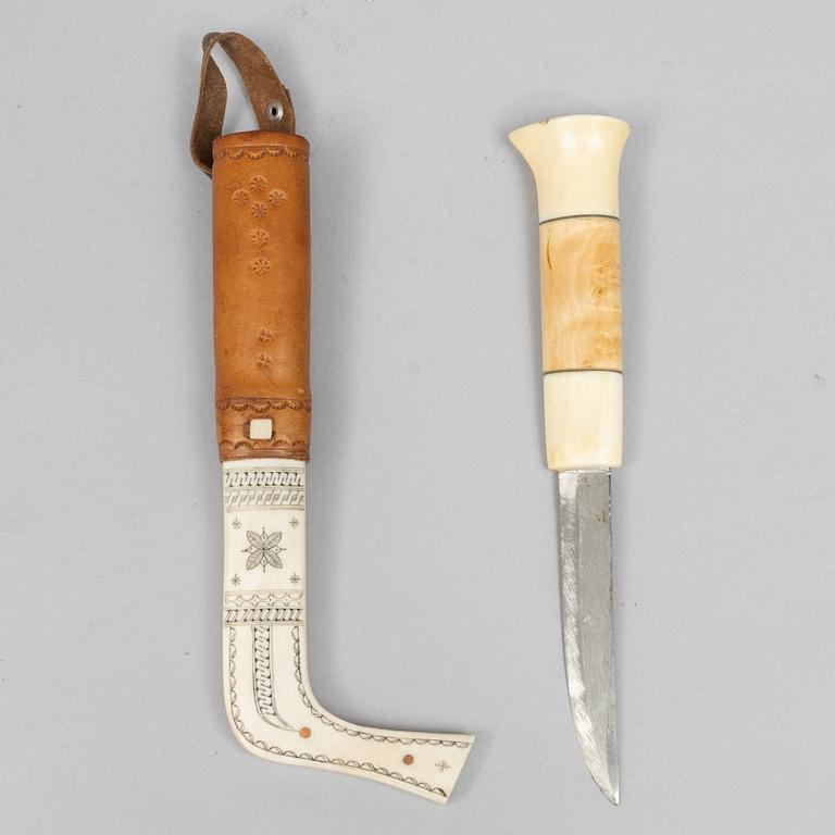 Oskar Tjäder, A reindeer horn knife, signed.