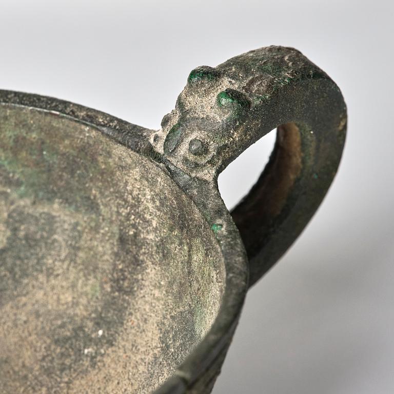 A Chinese brushpot, Qing dynasty, circa 1900. An archaistic bronze ewer and a silvered South East Asian bowl with stand.