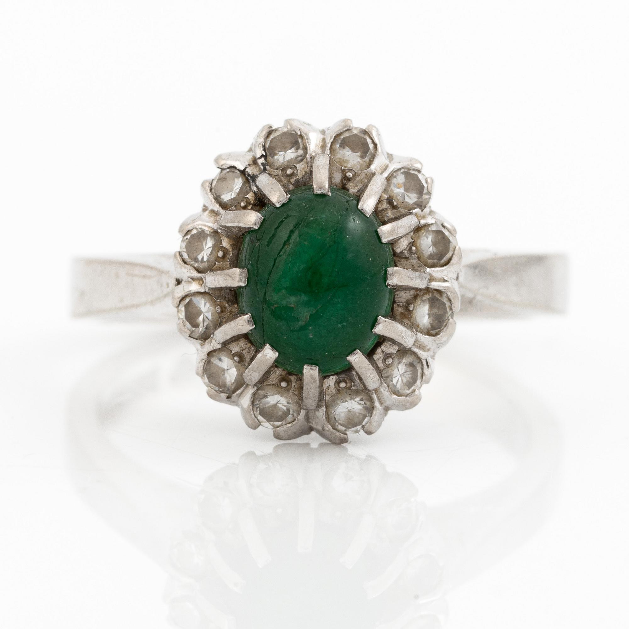 Ring, 18K white gold with cabochon-cut emerald and brilliant-cut diamonds.