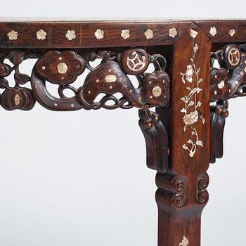 A Chinese hardwood demi-lune side table with mother-of-pearl inlays, late Qing dynasty.