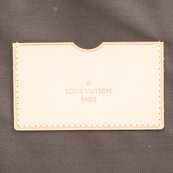 A Monogram Canvas Pégase 65 Suitcase with a Protective Cover.