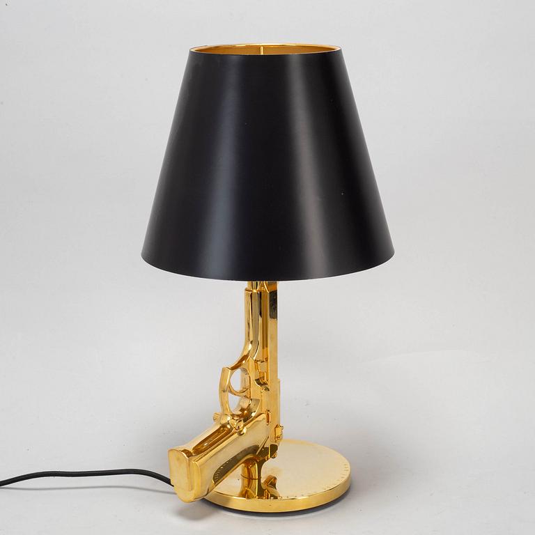 PHILIPPE STARCK, a 'Gun bedside Lamp', for Flos.