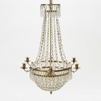 An Empire-style six-branch chandelier, circa 1900.