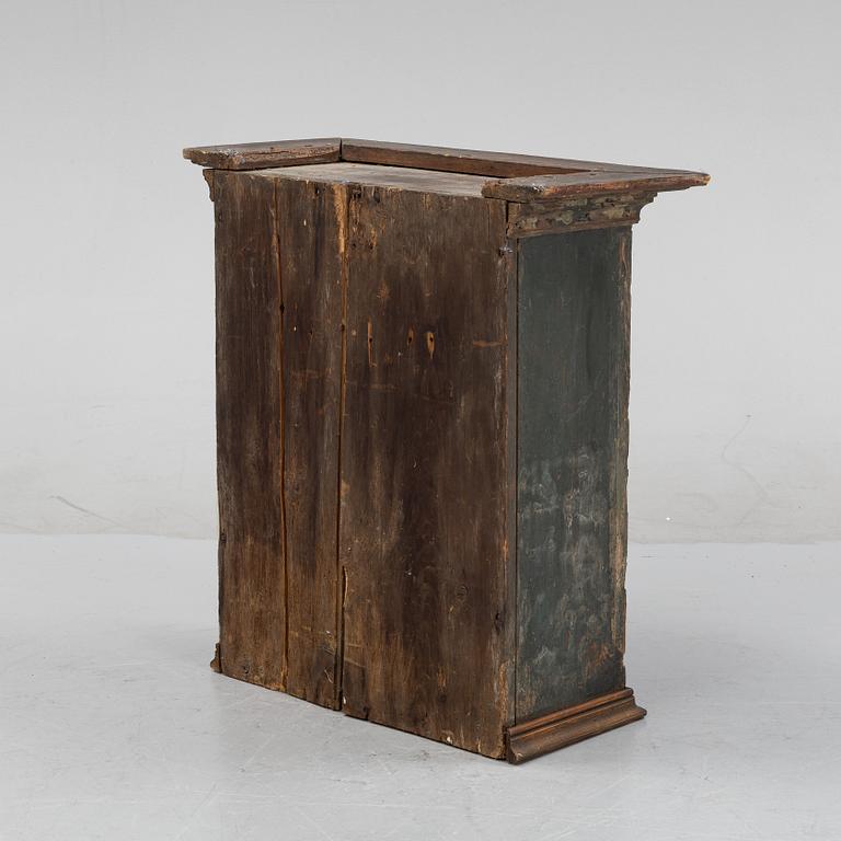 A Swedish provincial wall hanging cabinet, 1833.