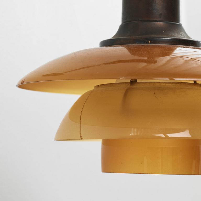 Poul Henningsen, a 'PH-2/2' wall lamp with amber coloured glass shades, Louis Poulsen, Denmark 1930's.