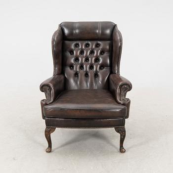An English late 20th century leather armchair.