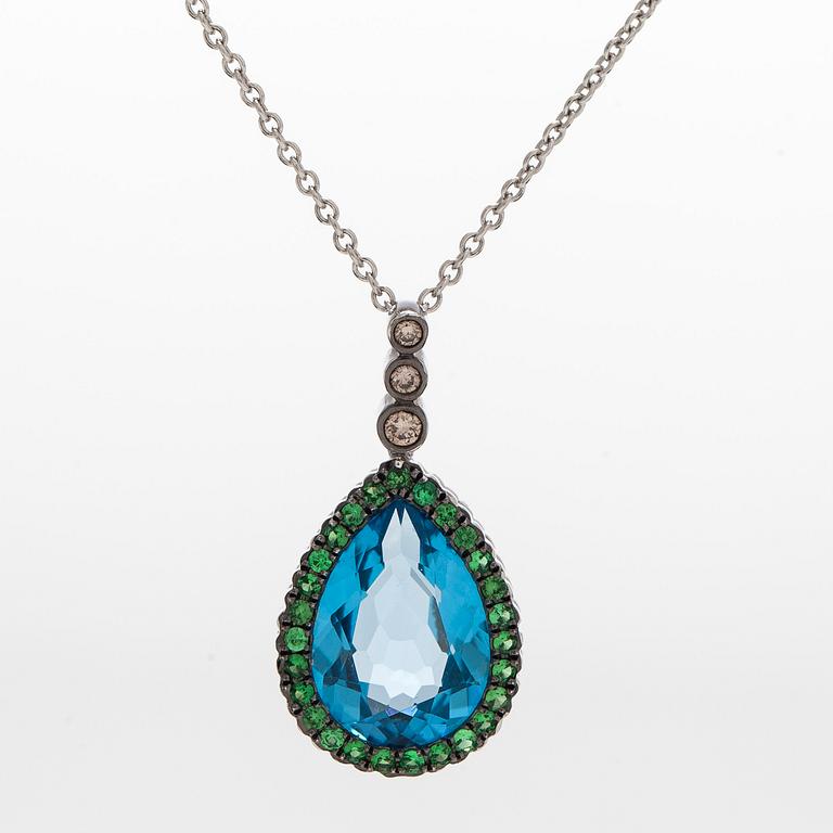 A 14K white gold necklace with pendant, topaz, brown diamonds.