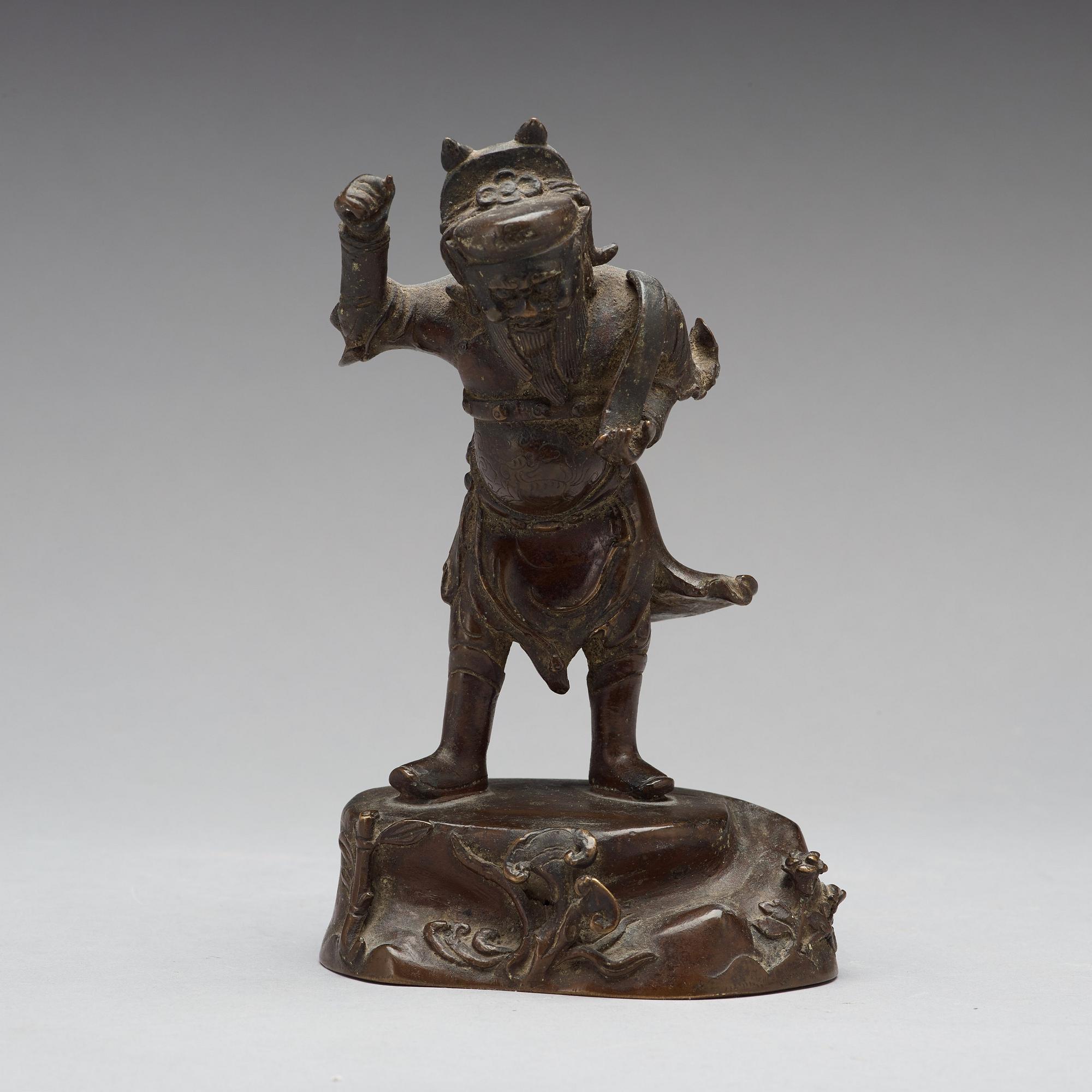 A bronze figure of a deity, Qing dynasty, 17/18th Century.