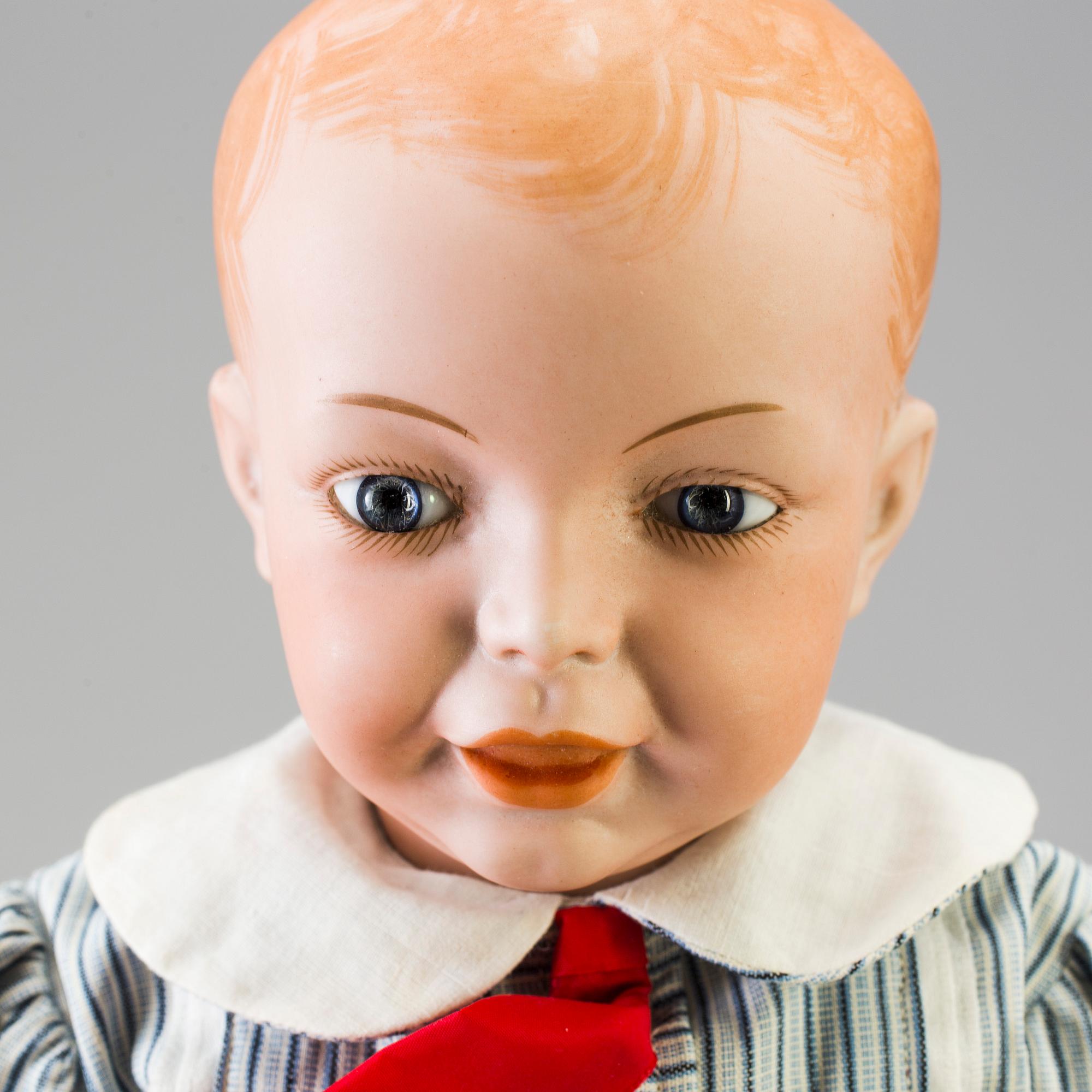 A bisque head character doll marked 226, probably France, 1910s.