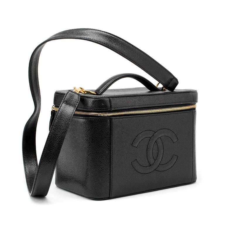 CHANEL, a black caviar leather beauty case.