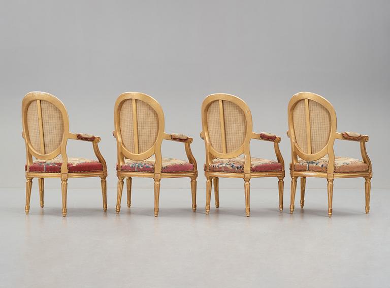 A set of four Louis XVI armchairs.