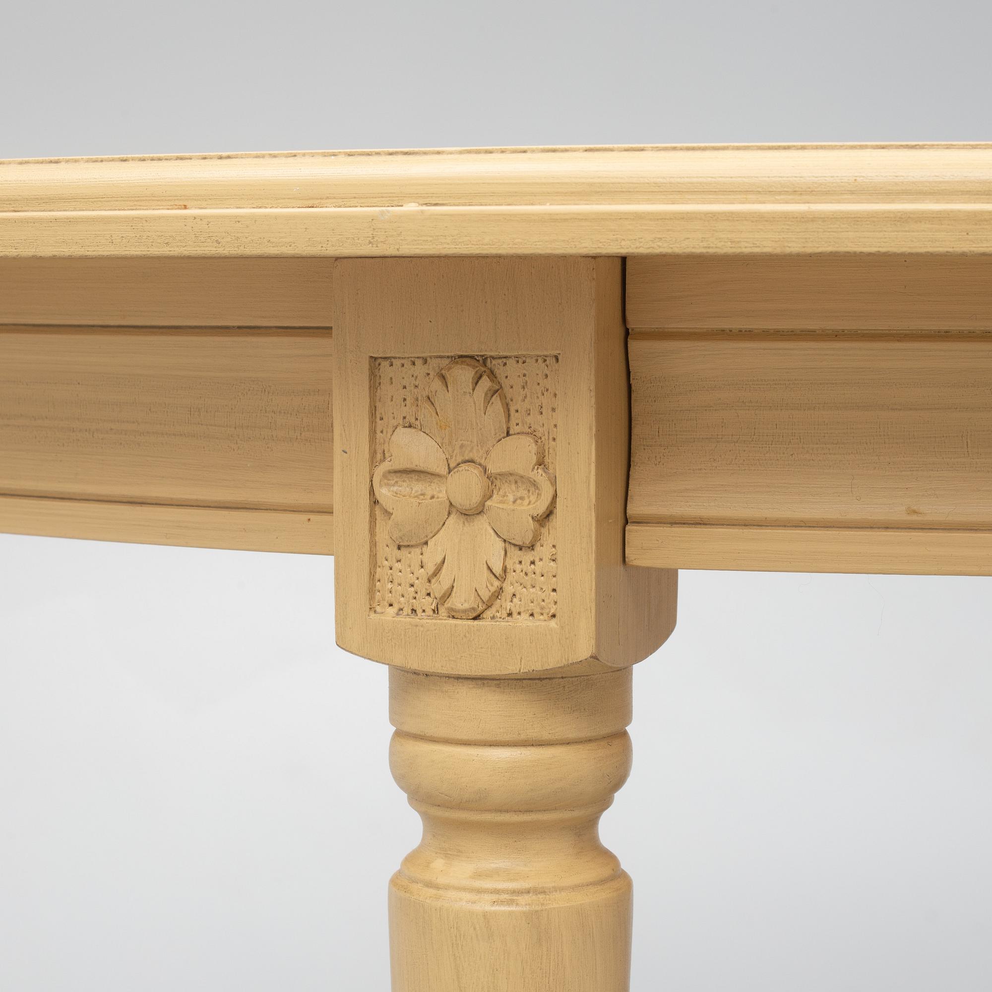 A Gustavian style dining table with six dining chairs, Sweden, 21st century.