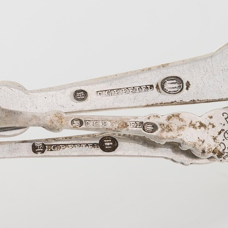 A set of  four silver serving spoons, with a set of 12 coffee spoons, Denmark, early and first half of the 20th century.