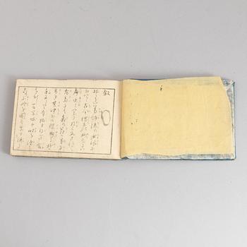 A group of five Japanese albums, including Katsushika Isai and Utagawa Kunisada, Meiji (1868-1912).
